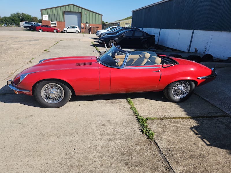 side view on a sunny day - red jaguar e-type s3 - Fostering Classics