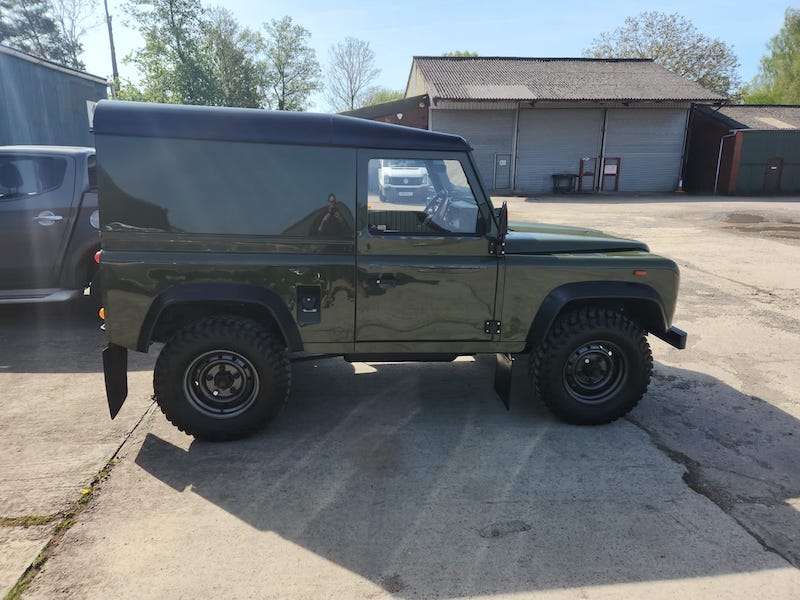 Land Rover Defender 90 - finished side view - Fostering Classics